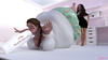 Girl inflates in front of her friend